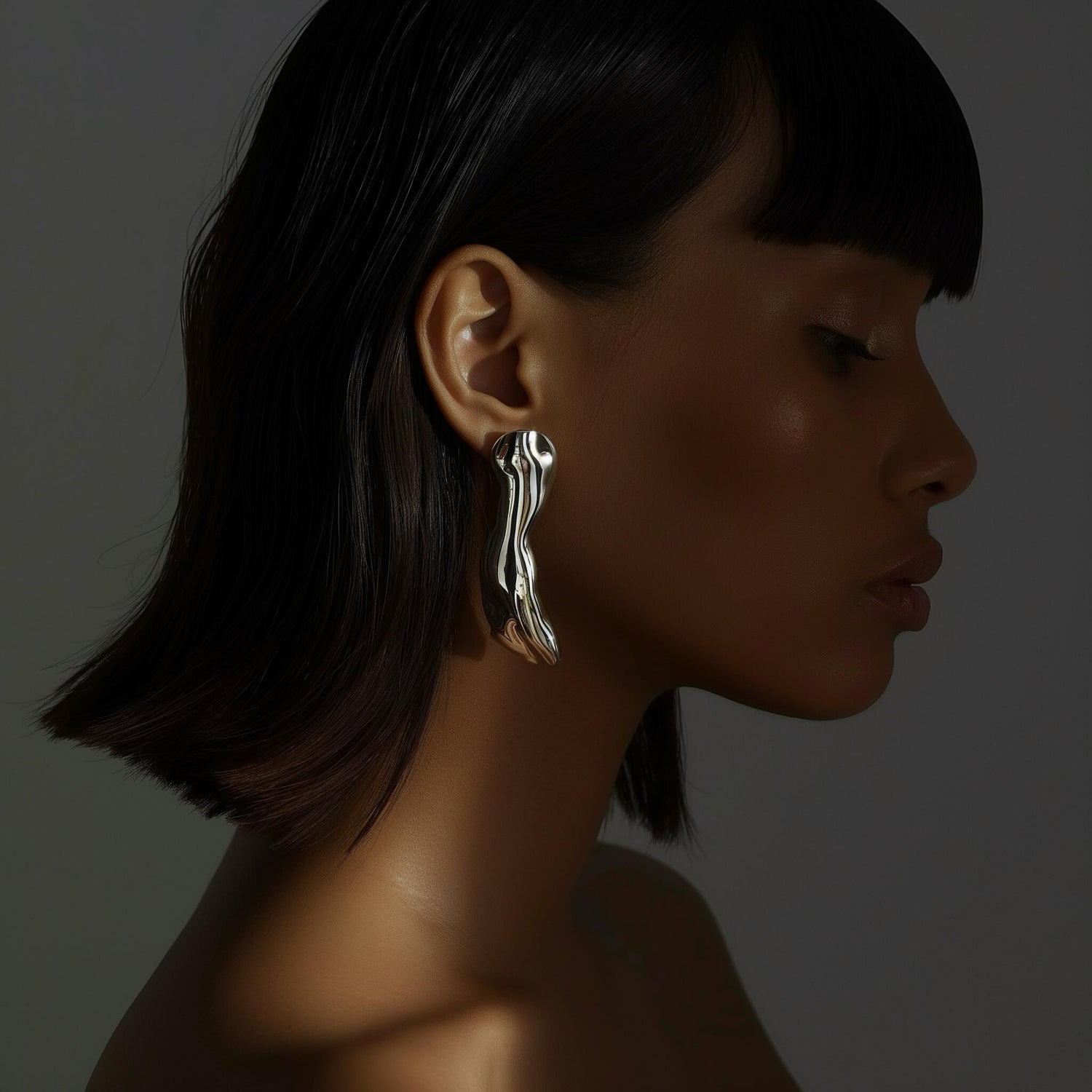 Model wearing STRAVAÉ statement earrings